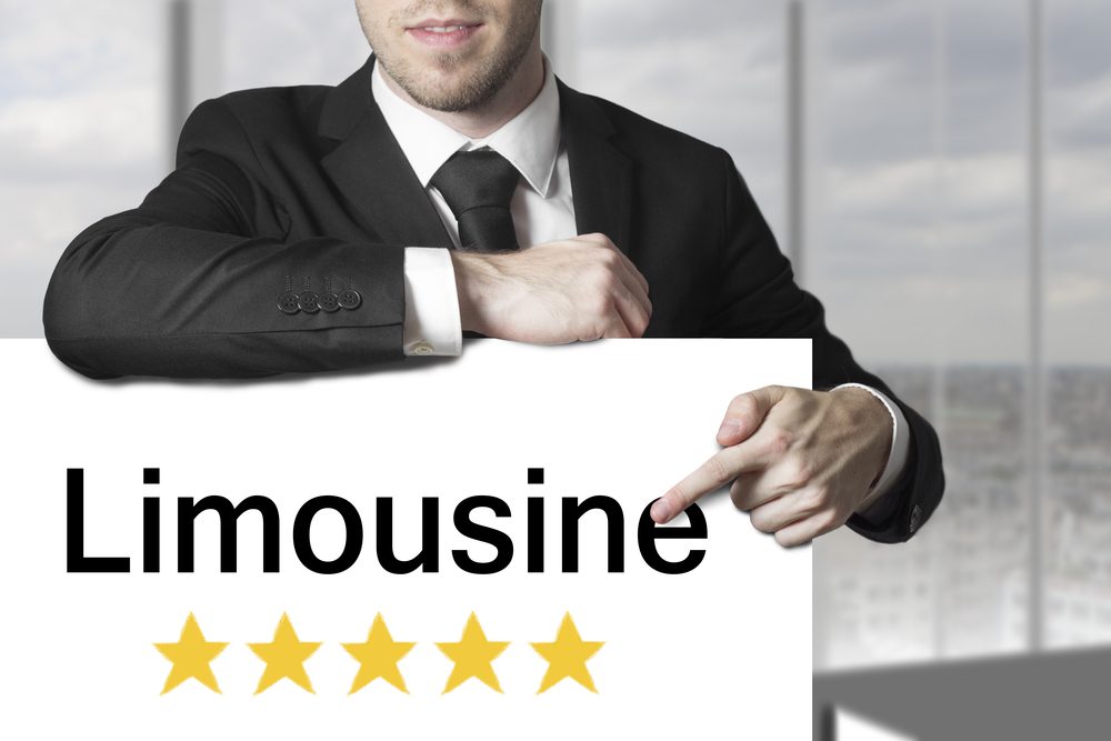 Businessman,Chauffeur,In,Black,Suit,Pointing,On,Sign,Limousine,Five Businessman,Chauffeur,In,Black,Suit,Pointing,On,Sign,Limousine,Five